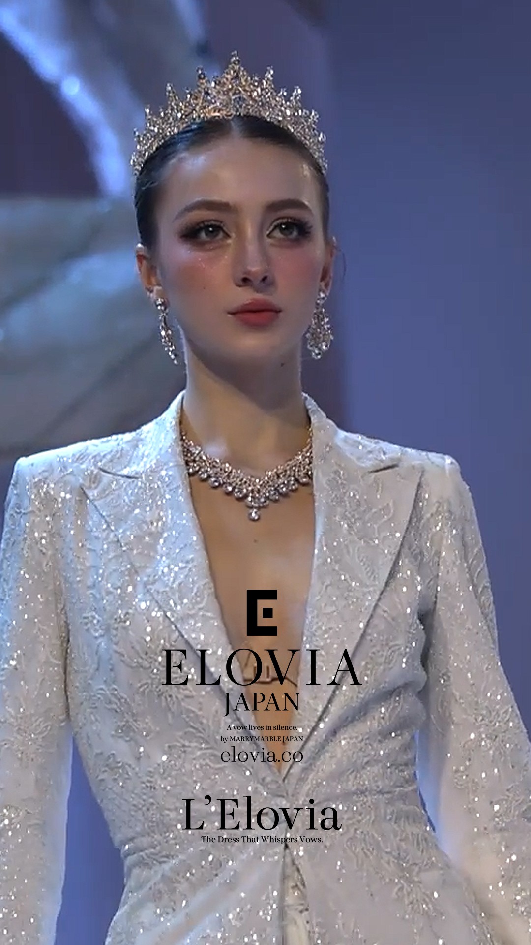 Close portrait of the Vowtail model wearing a tiara and couture jewelry